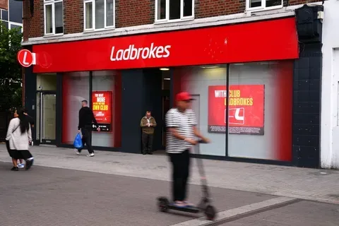 Ladbrokes app racing screen and set a deposit limit message